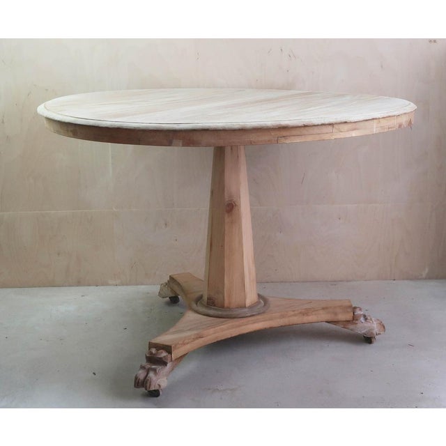 Fabulous small round table. Made from bleached tropical hardwood and pine Lions paw feet I particularly like its...