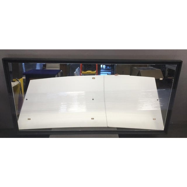 This full-length black framed mirror comes with two cleats to hang the mirror. Hangs horizontally. 112"W X 3"D X 57"H.