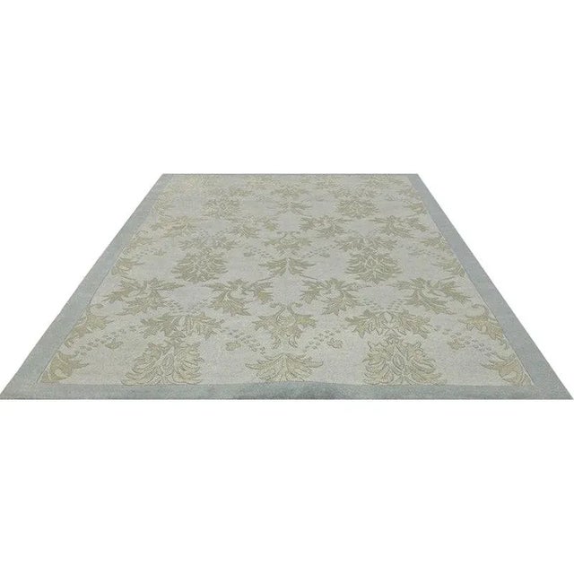 Handwoven transitional Style Area Rug featuring an allover design in gold pattern on a light blue colored background....