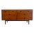 This mid-century modern style double dresser features a rich warm walnut finish, clean geometric lines, and iconic...