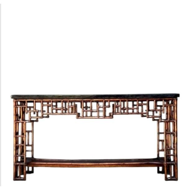 ​Embodying the quintessential glamour of mid-century Palm Beach Regency design, this striking Chippendale console table is...
