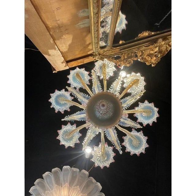 The Antique Venetian Opalescent and Pink Chandelier is a stunning piece of lighting that adds a touch of elegance to any...