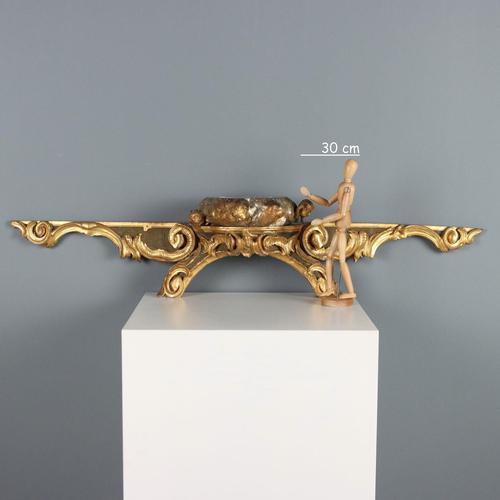 Carved, lacquered, and gilded wooden canopy rail. Base with Rocaille-style scroll carvings, gilded Mecca-style top...