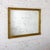 Fabulous vintage Neoclassical Rococo or French Louis style wall mirror composed of a rectangular ornate gilded wood and...
