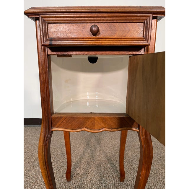 This amazing nightstand has a beautiful marble top. The piece looks great and has an awesome style. The marble interior is...