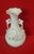 Beautiful biscuit vase with elaborate embossed floral decoration. It has two handles. Elegant and classic style, with...
