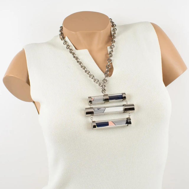 This stunning chunky Emilio Pucci silvertone metal and silk necklace features a futuristic abstract shape, a heavy...