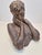 This is a vintage 1980s bust done with Plaster of Paris (PoP). This sculpture is signed on the back by artist Rita Coppel...