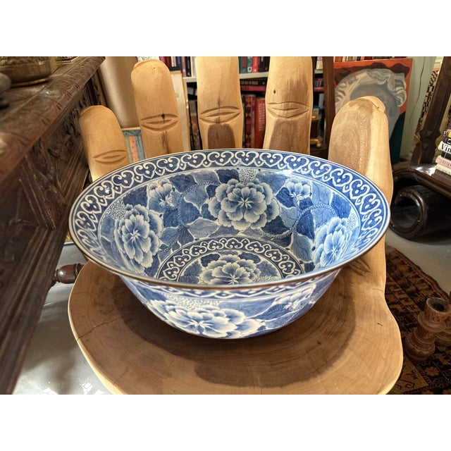 A substantial and finely crafted blue and white porcelain bowl by Maitland-Smith, known for producing high-end decorative...