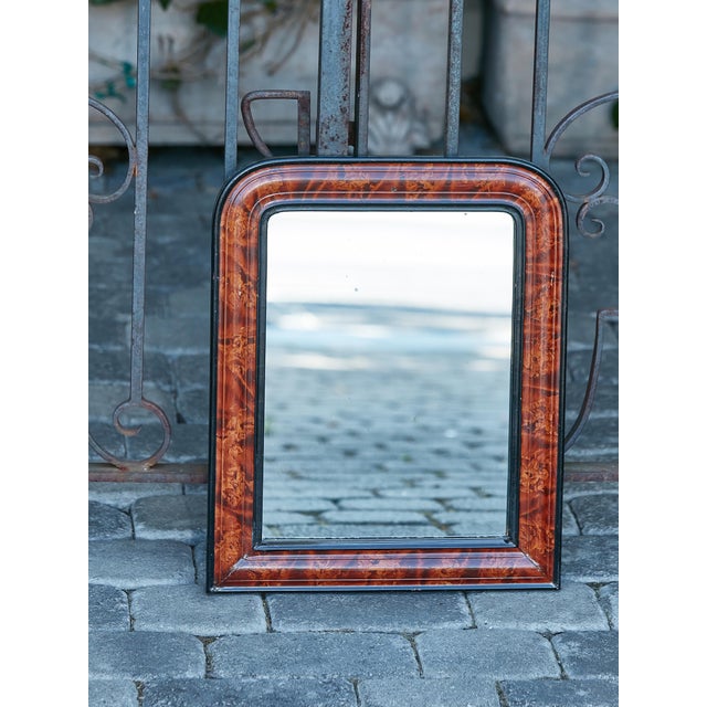 A small French Louis-Philippe style wooden mirror from the early 20th century, with tortoise style painted frame, brown...