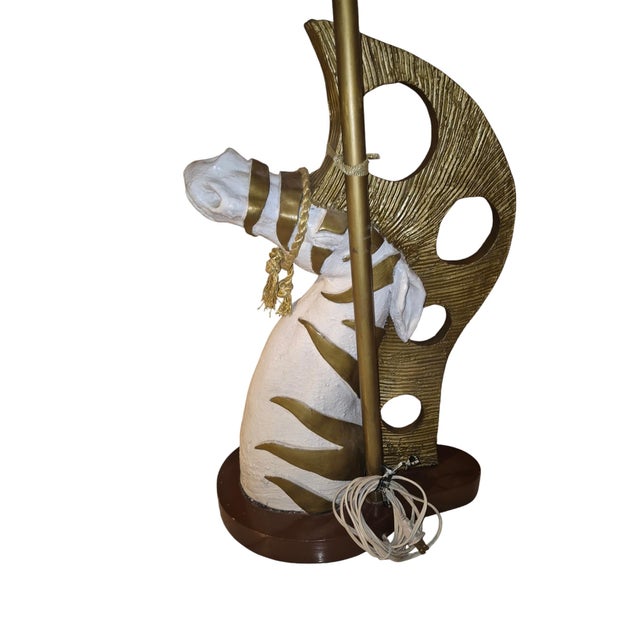 This is a zebra lamp circa approximately 1957. zebra made out of plaster with a wooden base. Has dual sockets for...