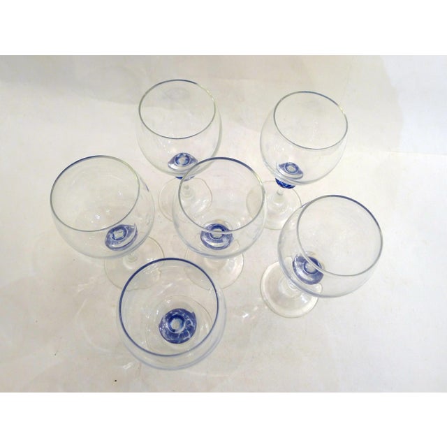 Set of 6 wine glasses, stemmed glasses with a balloon-shaped body in colorless glass and a base decorated with a speckled...
