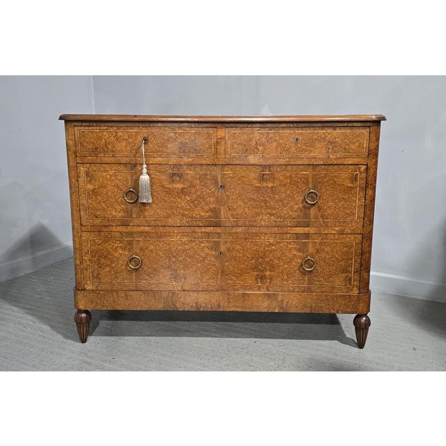 Top quality four drawer French commode chest of drawers in Amboyna, inlaid with tulipwood banding, gilded handles,...