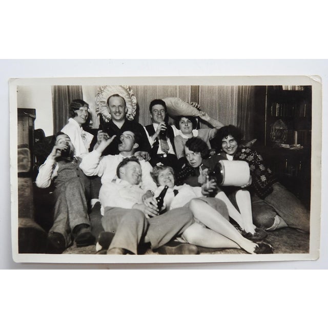 1930's party time snapshot photograph of a group of friends goofing off. Unframed, corner bumps.