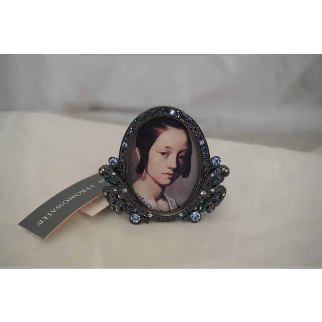 Small Sapphire & Gunmetal Jay Strongwater Frame Oval frame surrounded by mix sapphire crystals. Mostly a traditional...