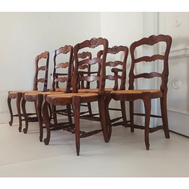 This beautiful set of six are from the 60s - 70s. They are all hand built with oak wood, rush seats, and hand carved...