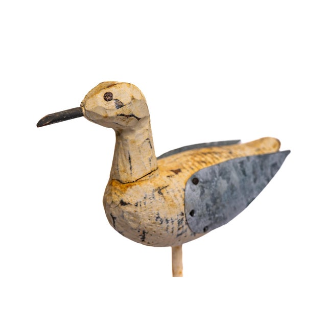 This folk art duck pairs hand-carved wood with riveted tin wings—a utilitarian detail that gives the piece its distinctive...