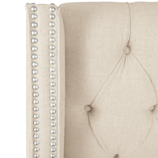 This Upholstered Bed brings hotel luxury to your bedroom. Crafted by hand, the headboard is designed with deep button-...