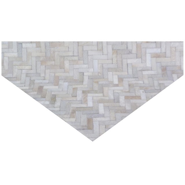 Carefully selected hair-on hide sections in various shades and colors are hand-stitched together to create a stunning and...