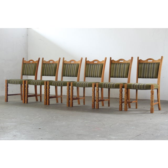 This set of six Danish Mid-Century Modern dining chairs, crafted in the 1960s, showcases the “Baroque Modern” or Brutalist...
