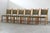 This set of six Danish Mid-Century Modern dining chairs, crafted in the 1960s, showcases the “Baroque Modern” or Brutalist...