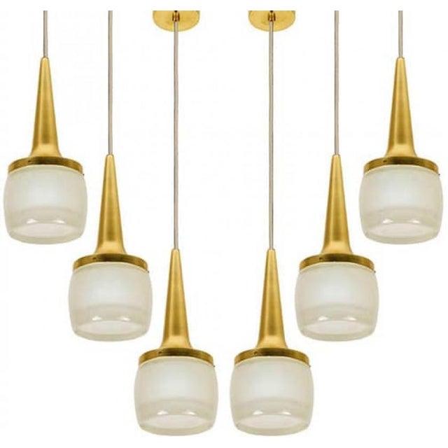 This pair of elegant cascade light fixtures was manufactured by staff leuchten in germany. The light is executed in...