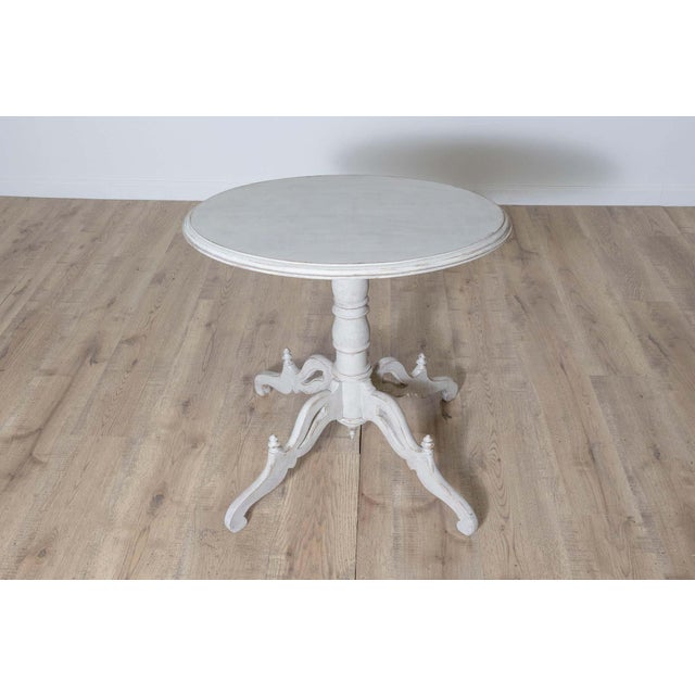 This elegant 20th-century Swedish pedestal table embodies the timeless simplicity and craftsmanship of Scandinavian...