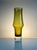 An elegant, sculptural glass vase, design number 1377, crafted in olive-green glass by the renowned Riihimäen Lasi Oy...