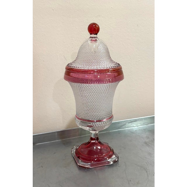 1930s-40s pink/clear hobnail glass lidded pedestal jar. Some spots where pink color is slightly fading/scuffed off at base...