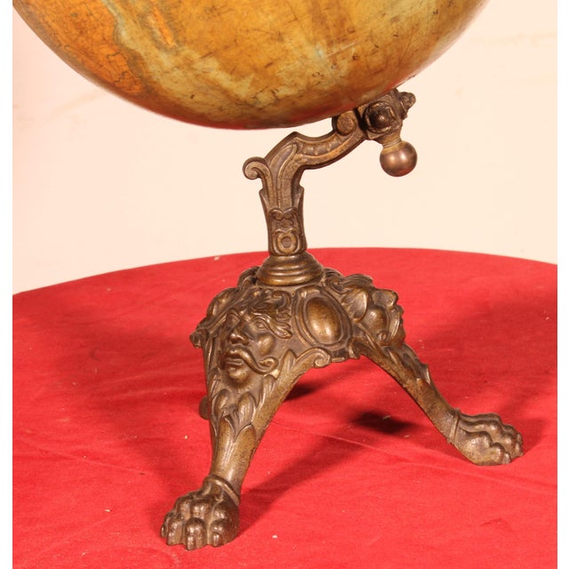 Exquisite terrestrial globe, made by Lebègue & Cie, Brussels. A very beautiful model with a superb cast iron base...