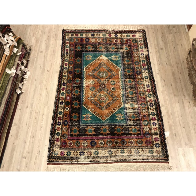 This is a vintage Turkish Oushak rug from the 1960s. The piece was hand-knotted.