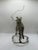 A striking large vintage wire horse and sulky sculpture, handmade from layered silver, brass toned, and dark metal wire....