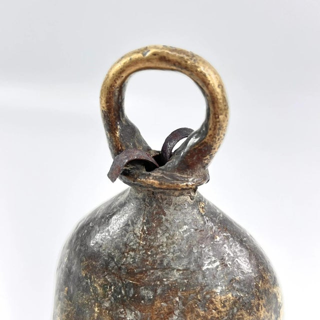 The brass metal bell was crafted by the Benue and Chamba artisans and metalworkers of Nigeria. These bells were often used...