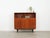 The cabinet was made in the 1970s, Danish production. The structure is covered with teak veneer. The legs are made of...