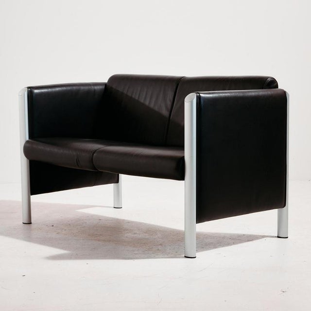 The ‘Model 830’ two-seater leather sofa designed by Klaus Franck & Werner Sauer for Wilkhahn in the 1990s. with some...