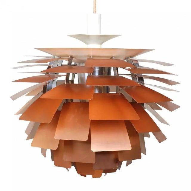 Designer: Poul Henningsen. Manufacturer: Louis Poulsen. Model: Kogle/Artichoke. Measurements: Ø: 60 cm. Materials: Copper....