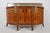 An exceptional walnut sideboard designed by Maurice Dufrène in France, circa 1911, bridging the lyrical elegance of Art...