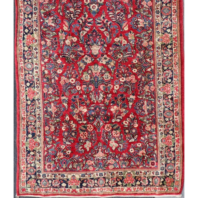 Antique Sarouk Long Gallery Runner With All-Over Flower Design in Red Background For Sale - Image 4 of 12