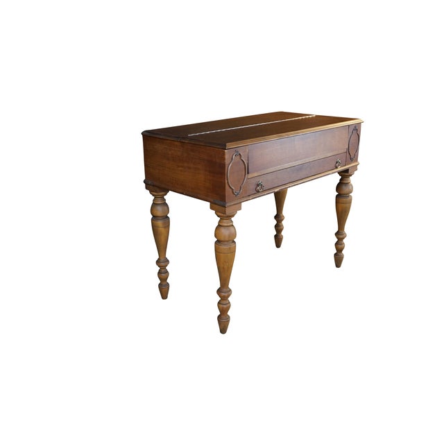 This antique early 20th century Victorian Revival spinet desk showcases the elegant craftsmanship and multi-functional...