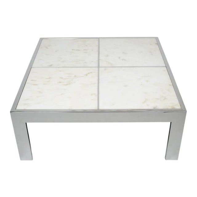 This is a 1970's Leon Rosen for Pace Collection coffee table, executed in chromed steel with a grid motif and a Portuegese...