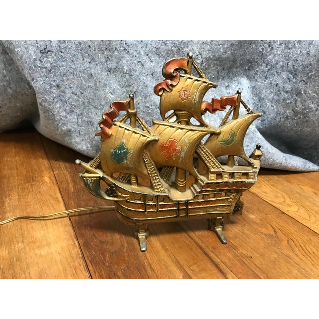 Offering this special night light which was built in the shape of a ship. When on, a small watt lamp glows behind the...