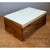 This vintage lidded box pairs richly figured hardwood with a pale bone-inlaid top in a clean, rectangular form. The case...