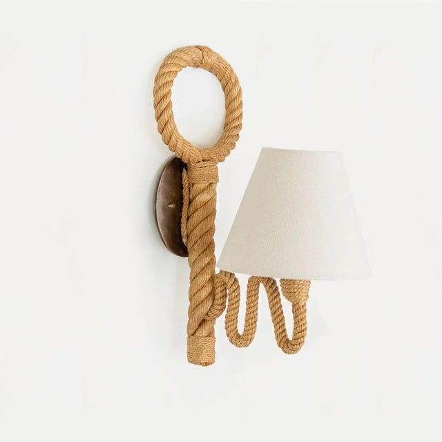Unique vintage French rope sconce by French designers Adrien Audoux and Frida Minet. Thick twisted rope stem with wavy...