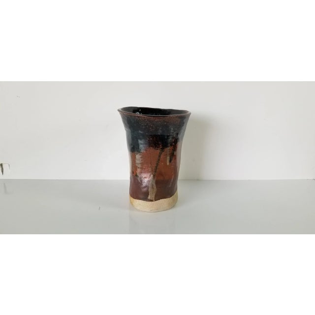For your consideration is a Mid-century handmade studio art pottery vase with earthy glazed brown colors in an abstract...