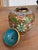 A beautifully detailed vintage Chinese cloisonné ginger jar, hand-enameled over a rich gold ground with a dense pattern of...