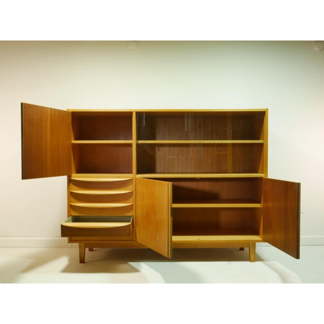 This highboard is an original piece from the 1960s. It belongs to the second generation of the 602/g furniture series by...
