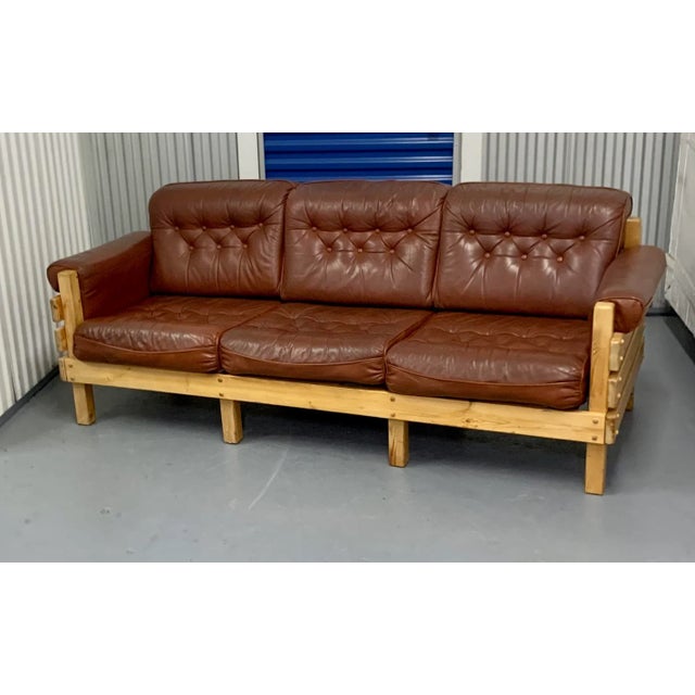 A large pine and beige fabric sectional sofa designed in the style of Sven Larsson and produced by Sven Larsson made in ,...