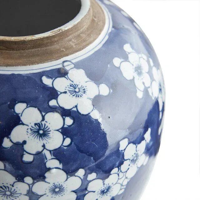 Hand painted Plum flower ginger jar in a stunning blue. 9" in diameter x 9" high.
