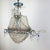 A beaded boat chandelier consisting of a tubular frame supporting sails made of beaded netting and various types of beads...