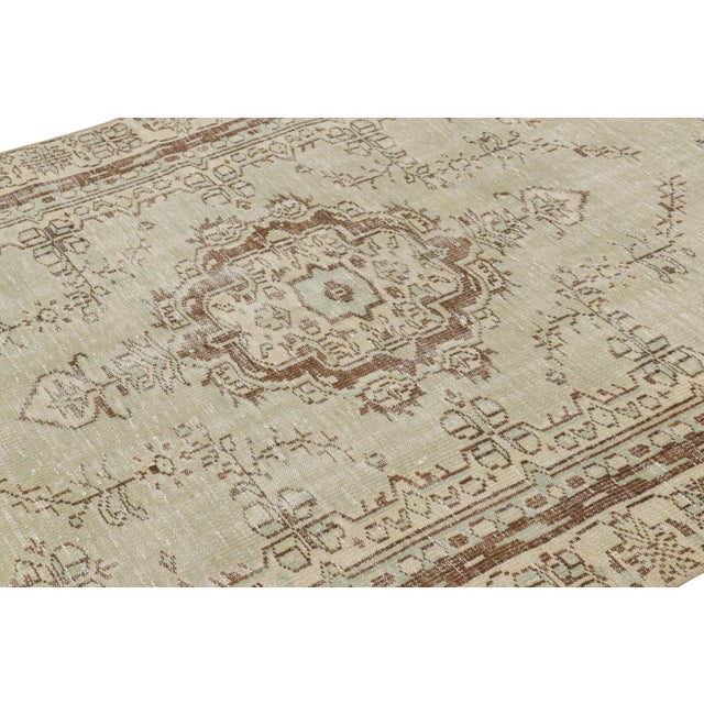 Hand-knotted in wool, this 5x8 vintage Turkish rug is from that collection of mid-century rugs with antique washes giving...